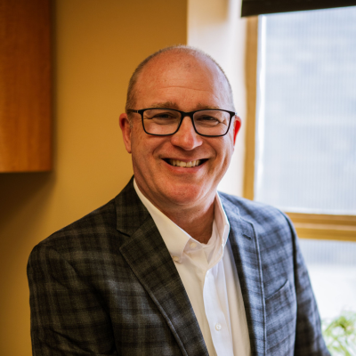 Dentist Seattle WA Thomas McKenny smiling for picture